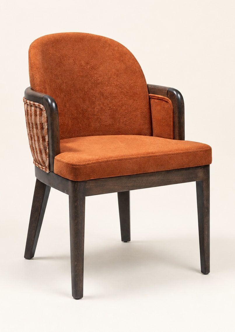 Ella armchair with rust-toned upholstery and woven side details