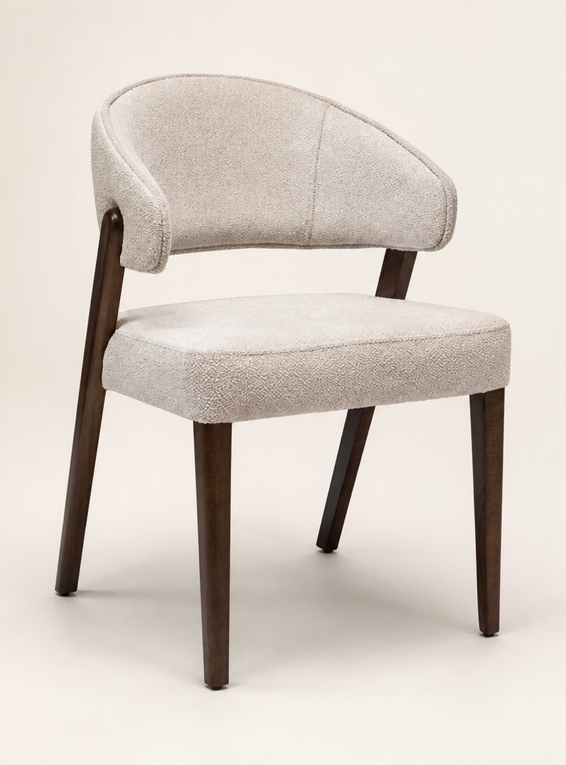 Raven chair with cream upholstery and a dark frame
